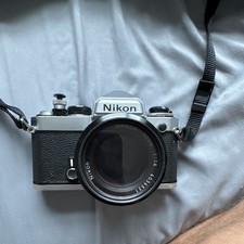 Nikon FE 35mm Film SLR Camera Silver/Black w/ Nikkor 50mm f/1.4 Lens Strap