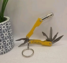 Cabelas Pocket Multi-Tool Flashlight Serrated Knife Can Opener Pliers Keychain 