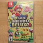 New ListingNintendo New Super Mario Bros. U Deluxe Switch Game w/ Case Multiplayer E