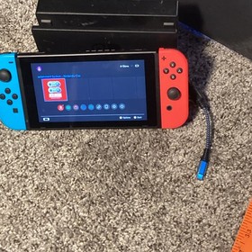 Nintendo Switch  with Neon Red and Neon Blue Joy-Con