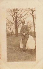 Postcard RPPC Man Newsboy Cap Leaning Against Rock AZO