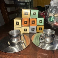 Nespresso Stainless Steel Cups & Saucers 2 Sets Plus 10 Espresso Sleeves