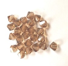 25 pc. SWAROVSKI CRYSTAL LIGHT SMOKED TOPAZ 6mm Loose BICONE Beads 5301 Lt Brown