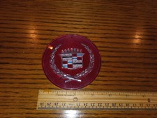 NOS  CADILLAC HUBCAP CENTER RED/WREATH 3-1/2' dia. 1980's 1990's