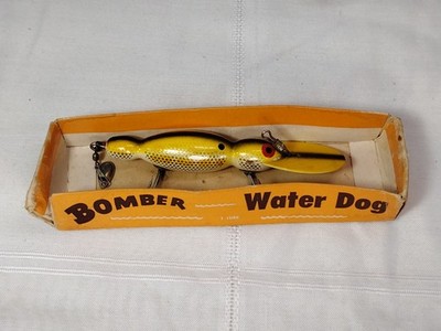 bomber water dog fishing lure Vintage Bomber Water Dog Fishing Lure Peanut Shaped Yellow Black Mid  Century USA