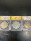 THREE Morgan silver dollars 1904o, EF, 1921 AU55, 1921 D AU58
