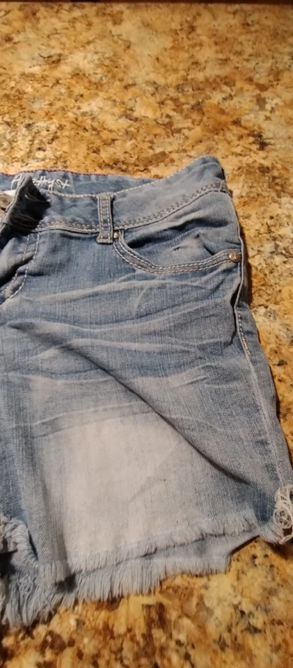 Pantalones cortos de mezclilla azul con bolsillos con solapa de corte desgastados talla 7 de amatista para mujer Foto 4 de 4