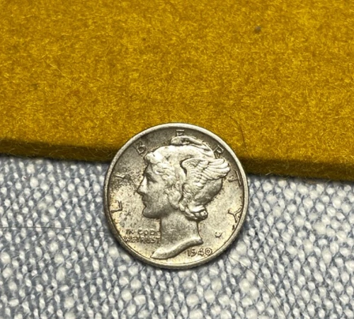 (#100577).  Mercury Dime: 1940 D  toned unc   (see video!!)