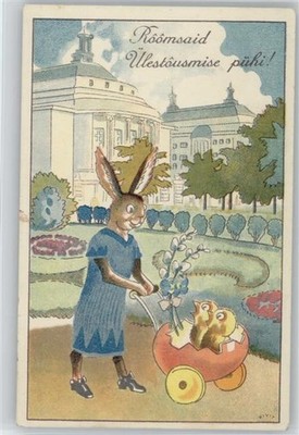 12035183 - Menschlicher Hase im Kleid schiebt Eierhaelften als Kinderwagen