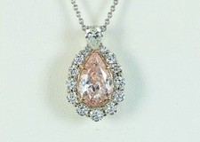 $250,000 Platinum 18K Rose Gold GIA Fancy Light Orangy Pink Pear Diamond Pendant
