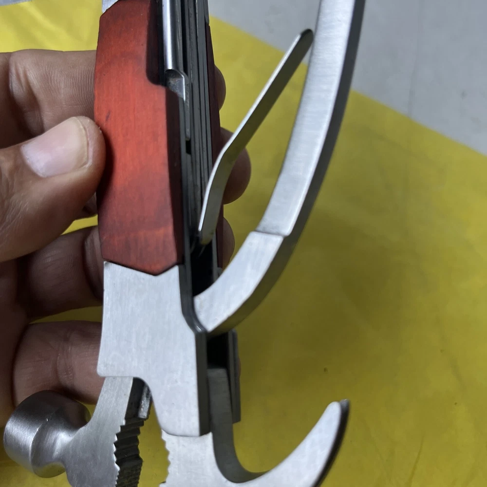 Compact Unbranded Multi-Tool with Knife, Saw, Hammer, Pliers & Bottle Opener (t11)