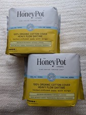 Almohadillas sanitarias a base de hierbas orgánicas The Honey Pot Company para mujeres flujo pesado con alas paquete de 2