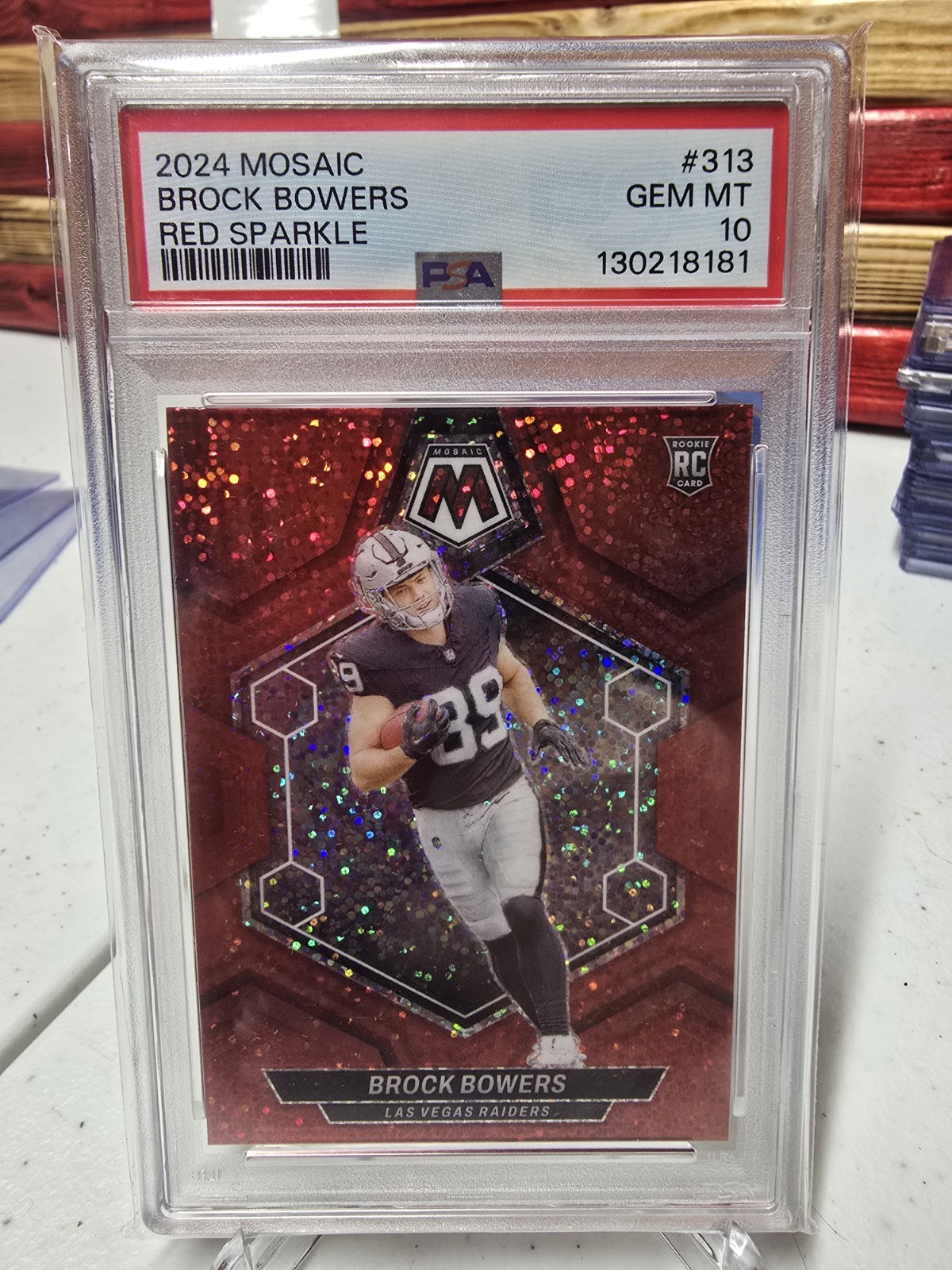 2024 Panini Mosaic - Rookies Brock Bowers #313 Red Sparkle Prizm (RC)