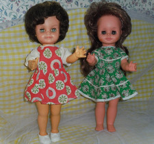 2 LOVELY VINTAGE DOLLS. ENGLAND. WEARING VINTAGE DRESSES. GOOD CONDITION.