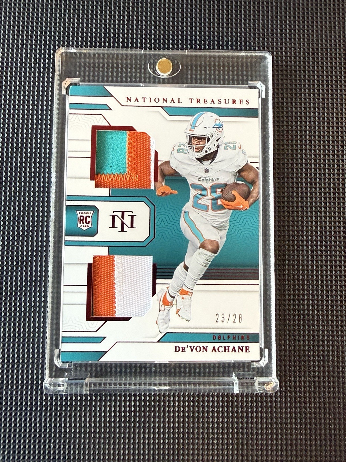 2023 Panini National Treasures Devon Achane Rookie Dual Patch Red /28 Dolphins