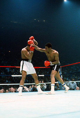 Mohammad Ali left dodges a punch by Jimmy Young right at the WBC - 1976 Photo
