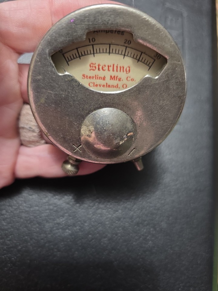 A 1910 pocket battery tester by Sterling Mfg Co — over 110 years old and still a working scientific instrument, fitting in your palm.