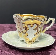 gold Demitasse teacup saucer gold hand painted design repaired handle Iridescent