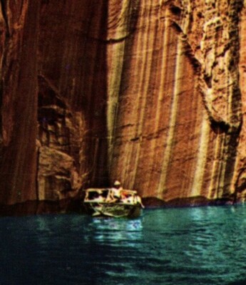 Boater along the Tapestry Wall in Twilight Canyon Lake Powell Utah-Arizona 