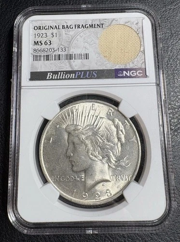 NGC MS63 Peace Dollar (1923)  Uncirculated with Original U.S. Mint Bag Fragment