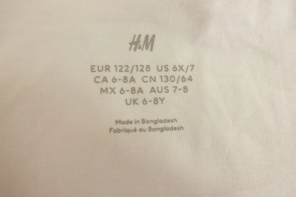 Paquete de 3 camisetas sin mangas de jersey de algodón blanco talla 6X/7 H&M para niñas nuevas con etiquetas *defecto Foto 2 de 4