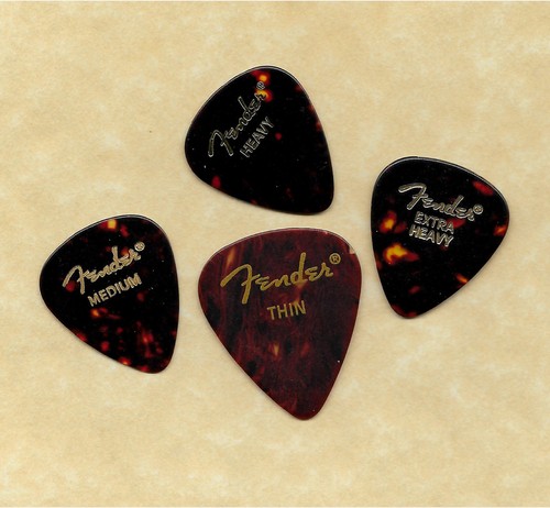 Fender guitar picks 3 451 shape 1990's celluloid shown with a 351 standard shape