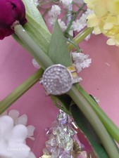 Womens size 7 ring. Round stone with small stones around ring. stunning ring.