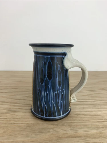 vintage studio pottery mug earthy cat tails sun motif indigo blue Signed