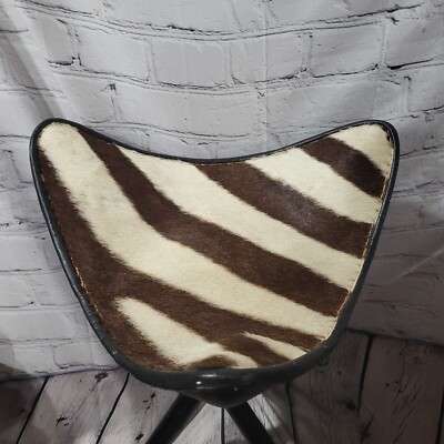 Vintage Zebra Tri leg Hunting Stool. Collapsible black wood rods brass cleats