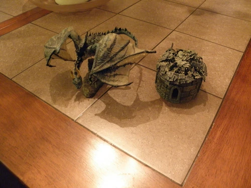 2005 MACFARLANE DRAGON WITH EXTRA ITEM.LOOKS TO BE SWOME KIND OF HUT