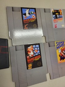 4x NINTENDO NES CARTRIDGE COASTERS UNUSED WITH CASE MARIO BROS METROID DUCK HUNT