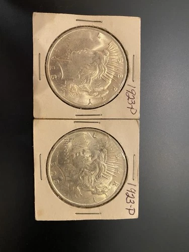 Lot of 2: 1923P peace silver dollar.  Uncirculated