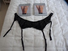 Ladies suspender belt size 10 and two packs of stockings
