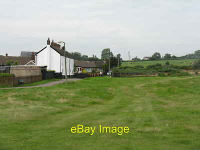 Photo 12x8 Houses by Oldcroft cricket ground  c2013