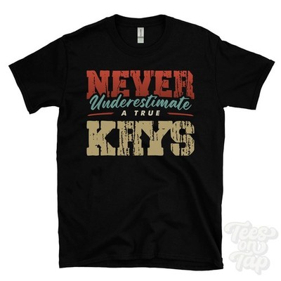 NEVER UNDERSCHIMATE A TRUE KRYS T-SHIRT - Wear Your Name Proudly