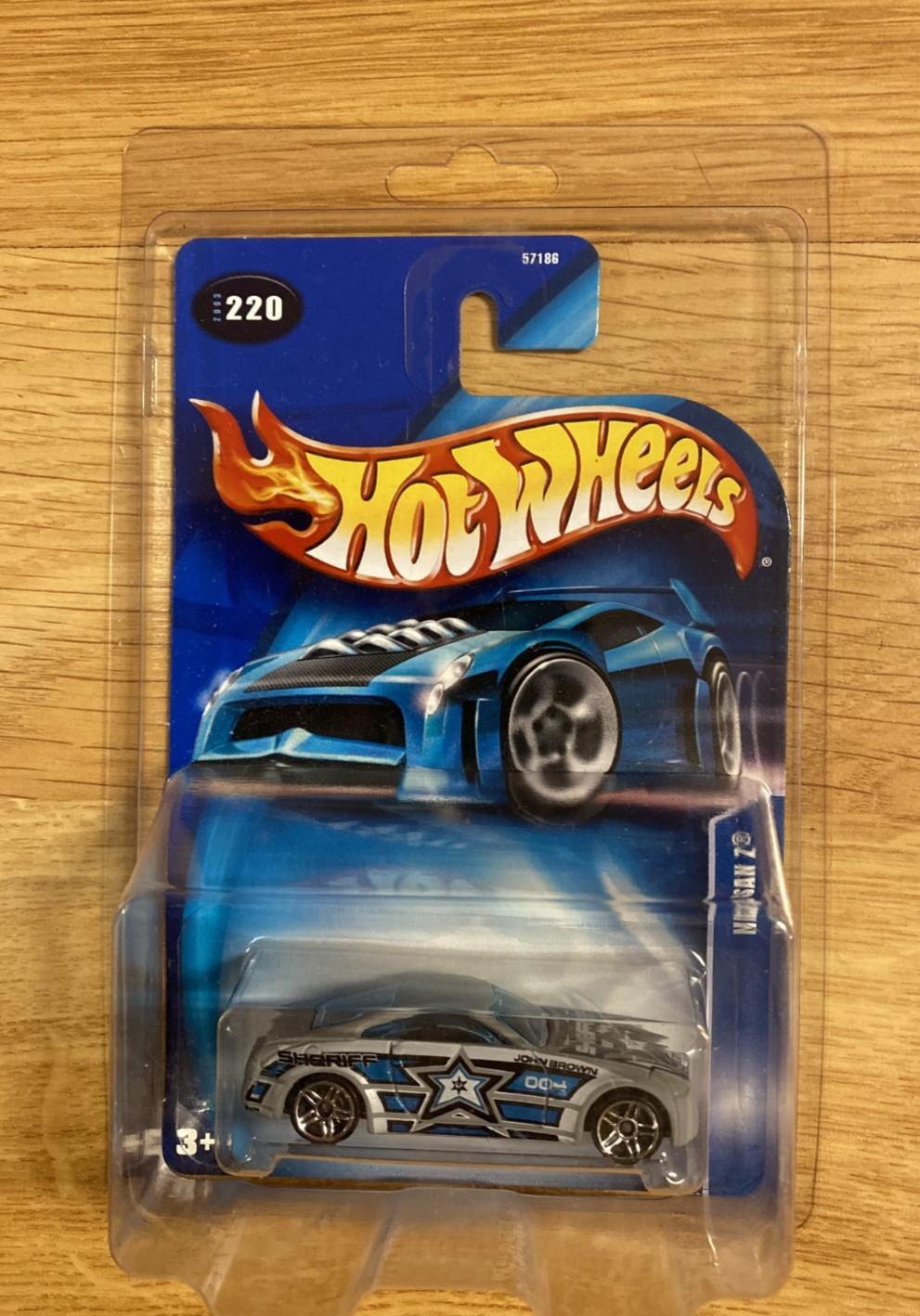 Hot Wheels #220 Nissan Z Sheriff John Brown MOC In Protect Pack 2003