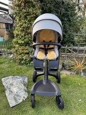 Stunning Stokke Xplory X in grey with deluxe genuine sheepskin liner raincover