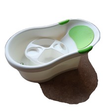 nuby baby bath with built in seat and soft headrest
