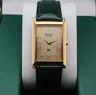 Vintage Seiko Slim Quartz Men's Wrist Watch Gold Dial with Green Strap.