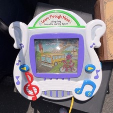 Two LeapFrog Learn Through Music Interactive ...