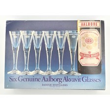 Elegant long-stem Aalborg Akvavit glasses from a legendary Danish distillery — a rare, sophisticated set for the Scandinavian spirits aficionado.