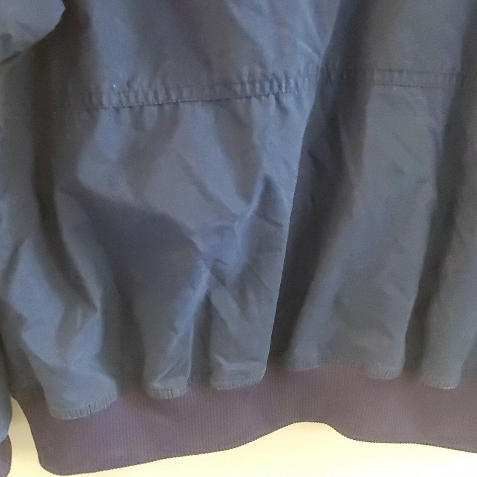 Chaqueta cortavientos Adidas para niñas talla M con capucha cremallera bolsillos ligeros azul blanco Foto 4 de 4