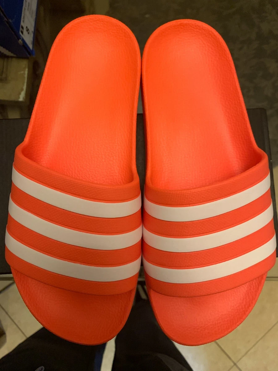 Adilette aqua hotsell slides red