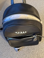 GUESS Small Black Round Logo Mini Backpack Zi...