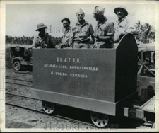 1943 Press Photo soldiers in South Pacific smile from the G. B. & T. Railroad