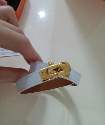 HERMÈS Bracciale Hermes Kelly pelle bianco e marrone accento oro