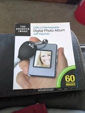 The Sharper Image 1.4” Digital Photo Album with Keychain USB 2.0 Rechargeable