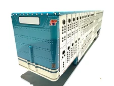 DCP / FIRST GEAR 1/64 SCALE WILSON LIVESTOCK TRAILER TRIPLE AXLE TEAL & SILVER