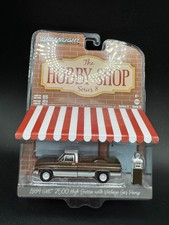 Greenlight Hobby Shop 1984 GMC 2500 High Sierra w/ Vintage Gas Pump, 1:64, E2