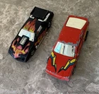 Vintage 1985 Hot Wheels Flip Outs Road Flipper Camaro and Flippin’ Frenzy Nissan